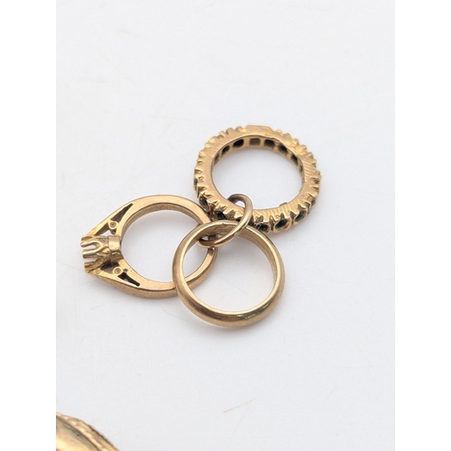 50 - Seven 9ct yellow gold charms comprising of three rings, two ballet shoes, a high heel, teapot and mu... 