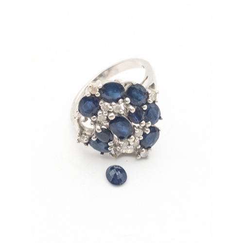 53 - A 9ct white gold sapphire and diamond cocktail ring (one sapphire loose and another missing) size N1... 