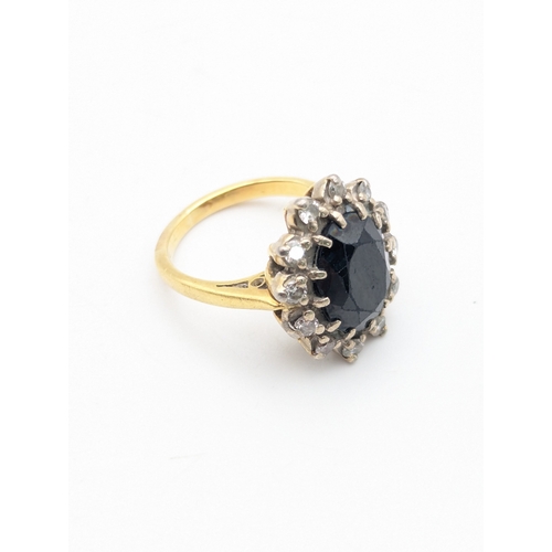 57 - A sapphire and diamond white and yellow metal ring tested as 18ct gold, size E 1/2, weight 5.2g
Loca... 