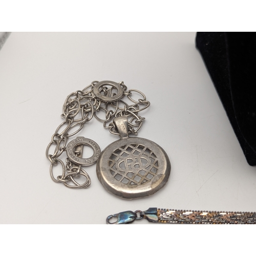 59 - Silver and white metal jewellery to include a sterling silver charm bracelet with an assortment of c... 