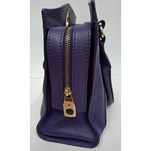 2 - Celine- A purple leather CE00/35 hand bag having silver tone hardware with ring design to the main b... 