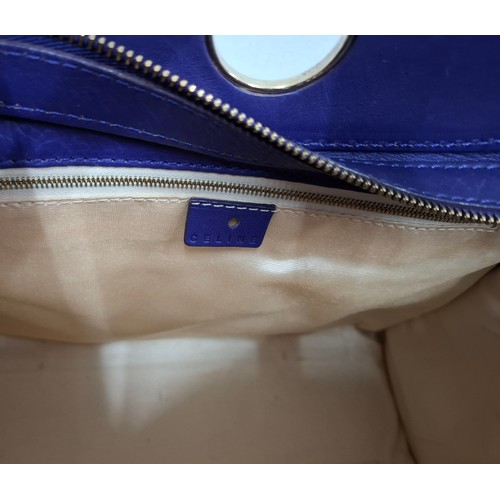 2 - Celine- A purple leather CE00/35 hand bag having silver tone hardware with ring design to the main b... 