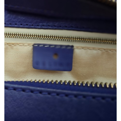 2 - Celine- A purple leather CE00/35 hand bag having silver tone hardware with ring design to the main b... 