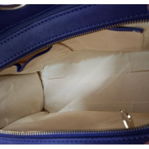 2 - Celine- A purple leather CE00/35 hand bag having silver tone hardware with ring design to the main b... 