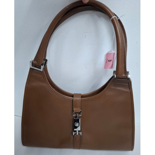 3 - Gucci- A brown Jackie Bardot leather shoulder bag having silver tone hardware, double handles, fabri... 