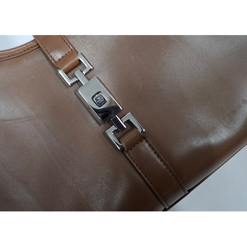 3 - Gucci- A brown Jackie Bardot leather shoulder bag having silver tone hardware, double handles, fabri... 