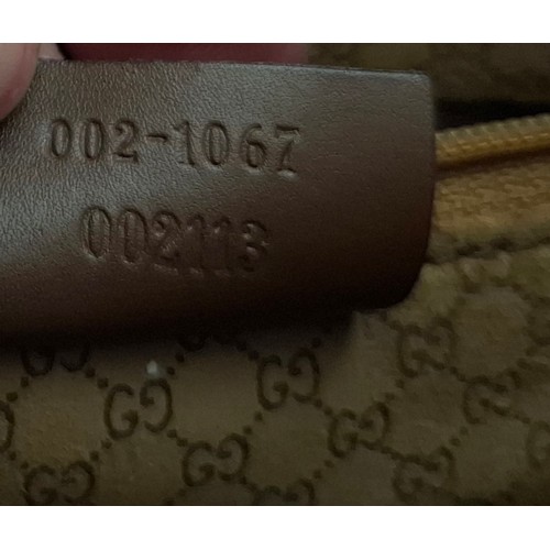 3 - Gucci- A brown Jackie Bardot leather shoulder bag having silver tone hardware, double handles, fabri... 
