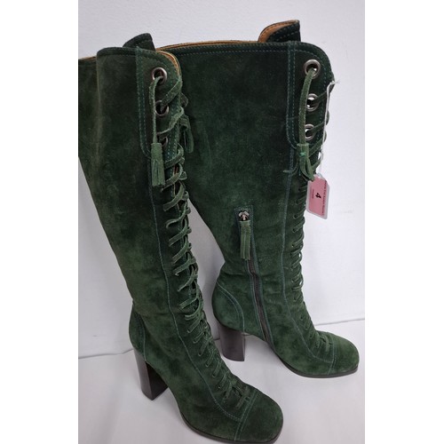 4 - Miu Miu- A pair of green suede lace up boots having a 3.5