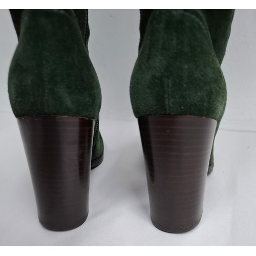 4 - Miu Miu- A pair of green suede lace up boots having a 3.5