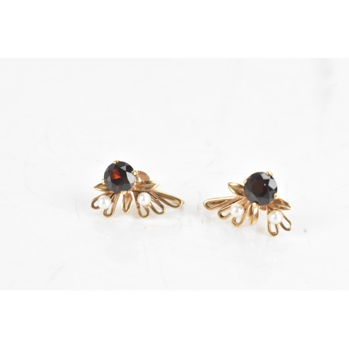60A - A 9ct gold garnet and seed pearl necklace and earrings suite, the necklace of foliate design with ro... 