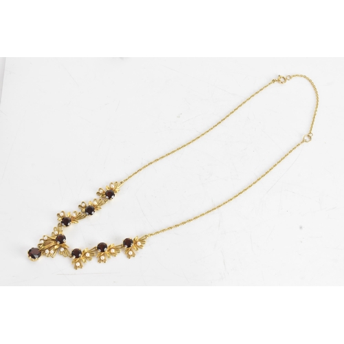 60A - A 9ct gold garnet and seed pearl necklace and earrings suite, the necklace of foliate design with ro... 