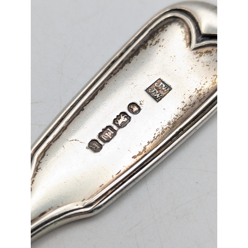 A Victorian silver sauce ladle having crest engraved to the terminals ...