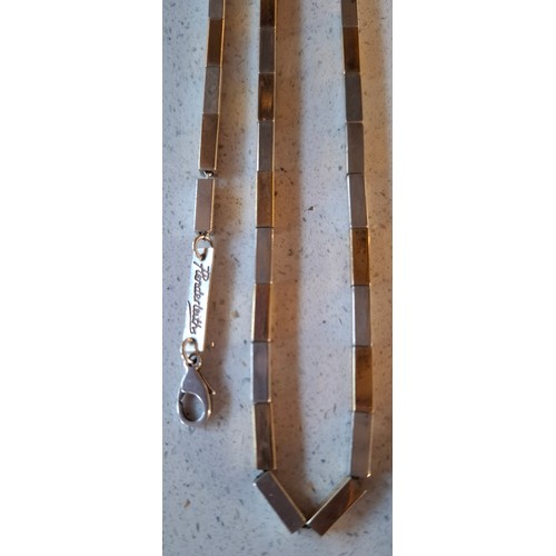 53 - A quantity of silver chains (min 41.5g). a Plenderleiths silver 2-tone necklace and matching bracele... 