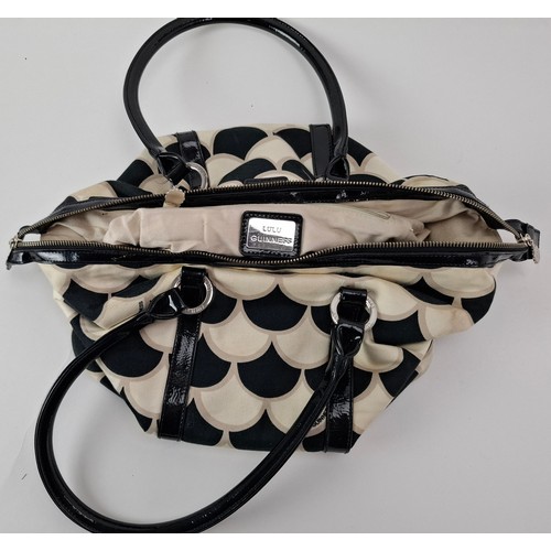 36 - Lulu Guinness- A fabric 50's scallop print pleated tote bag in black, white and beige having black p... 