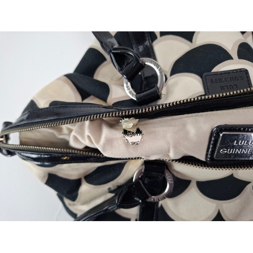 36 - Lulu Guinness- A fabric 50's scallop print pleated tote bag in black, white and beige having black p... 