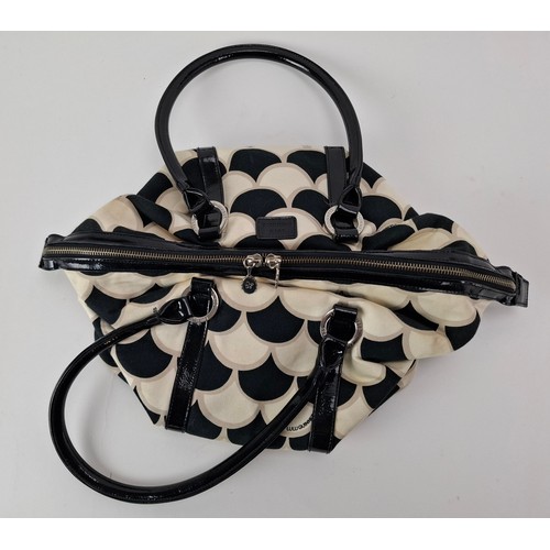 36 - Lulu Guinness- A fabric 50's scallop print pleated tote bag in black, white and beige having black p... 