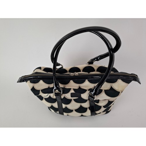 36 - Lulu Guinness- A fabric 50's scallop print pleated tote bag in black, white and beige having black p... 