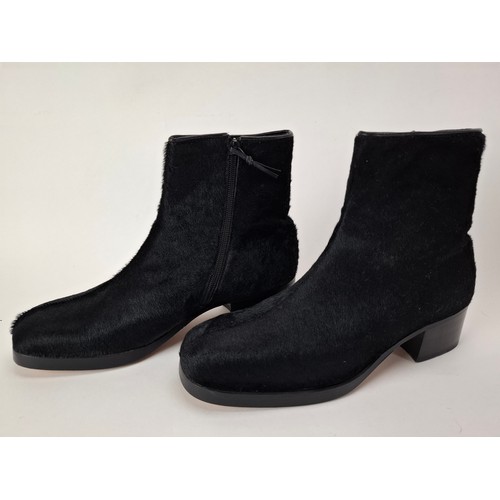 9 - Gucci- A pair of unworn gents black hide ankle boots 'Nero 19' having a side zipper with leather tog... 