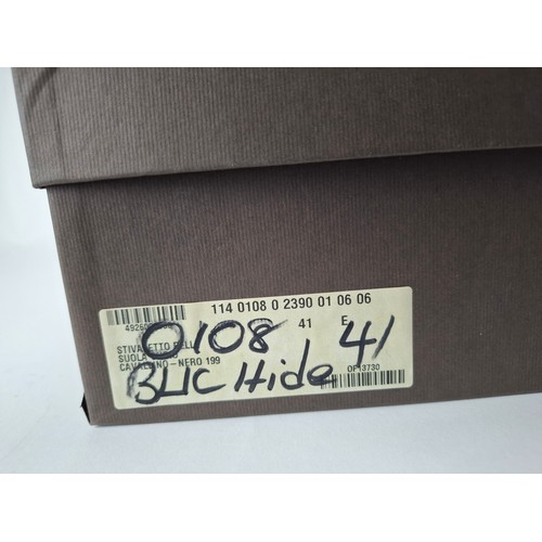 9 - Gucci- A pair of unworn gents black hide ankle boots 'Nero 19' having a side zipper with leather tog... 