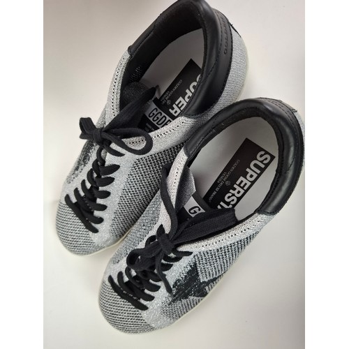25 - Golden Goose- A pair of 2017 gents Slide sneakers in silver and black, having a glitter effect with ... 