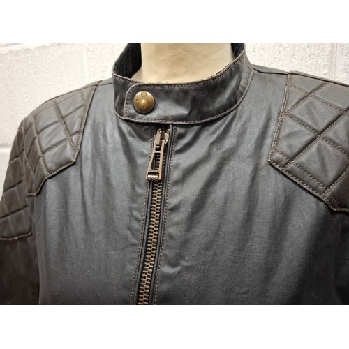26 - Belstaff- A gents dark brown wax cotton biker style jacket having a tartan lining and black cord col... 