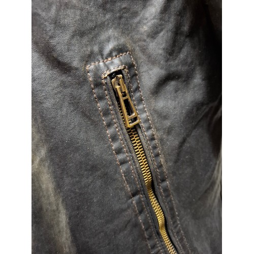 26 - Belstaff- A gents dark brown wax cotton biker style jacket having a tartan lining and black cord col... 