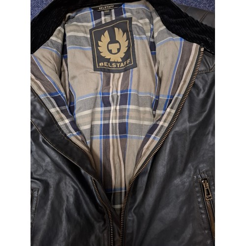 26 - Belstaff- A gents dark brown wax cotton biker style jacket having a tartan lining and black cord col... 
