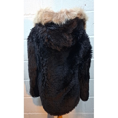 6 - Saint Laurent- An unworn Autumn 2016 black faux fur coat with black padded lining, black leather det... 