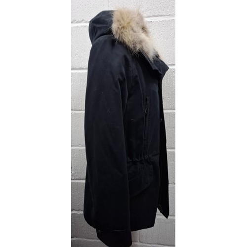 29 - Yves Salomon- An unworn black cotton parka coat having a detachable black rabbit fur lining and coyo... 
