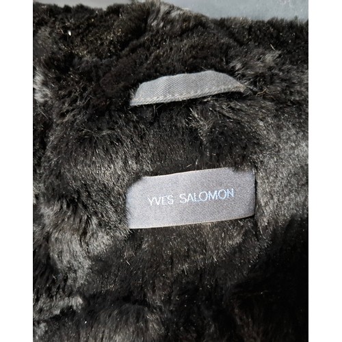 29 - Yves Salomon- An unworn black cotton parka coat having a detachable black rabbit fur lining and coyo... 