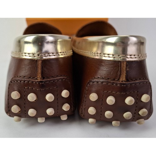 14 - Tod's- A pair of ladies Gommini moccasins in dark brown with silver accents, European size 38 having... 