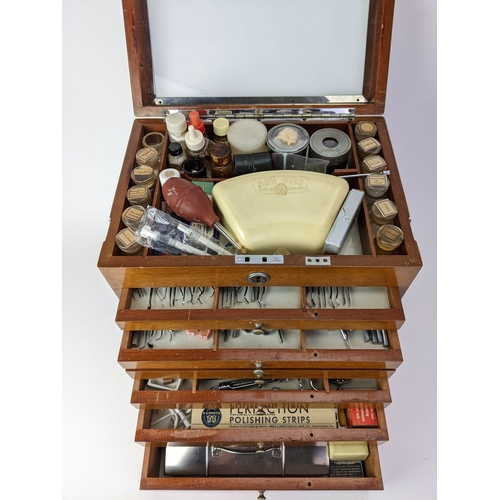 30 - A 1940s dentists portable mahogany cabinet, with a hinged lid and chrome carrying handle, over six g... 