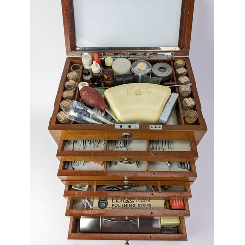 30 - A 1940s dentists portable mahogany cabinet, with a hinged lid and chrome carrying handle, over six g... 