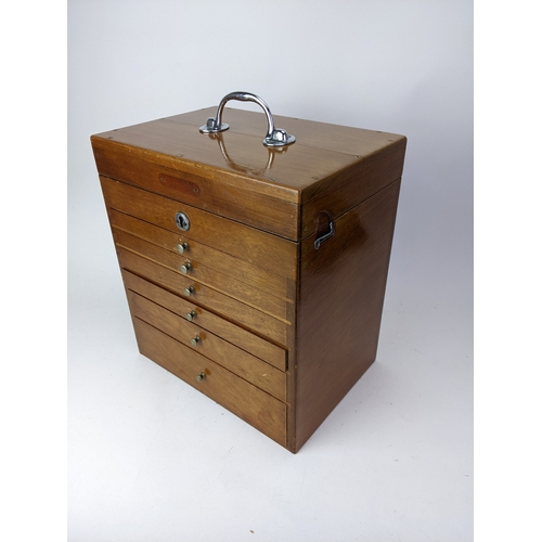 30 - A 1940s dentists portable mahogany cabinet, with a hinged lid and chrome carrying handle, over six g... 