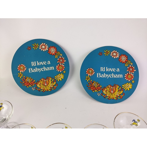 31 - Babycham collectibles to include a set of six glasses, with the emblems and a pair of card coasters
... 