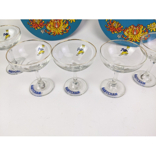 31 - Babycham collectibles to include a set of six glasses, with the emblems and a pair of card coasters
... 