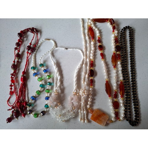 60 - Vintage bead necklaces to include painted glass examples, a mid 20th Century coral necklace, pearl n... 