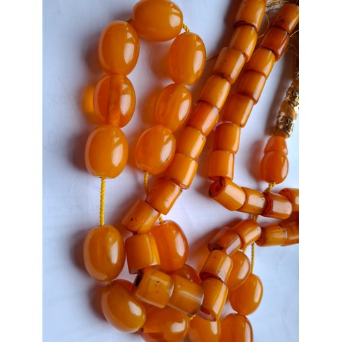 48 - A string of amber beads and a string of amber coloured beads. Location:A1B
If there is no condition ... 