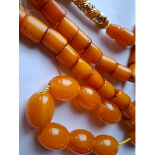 48 - A string of amber beads and a string of amber coloured beads. Location:A1B
If there is no condition ... 