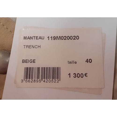 31 - Courreges of Paris-An unused beige 'Manteau' trench coat, approx 46