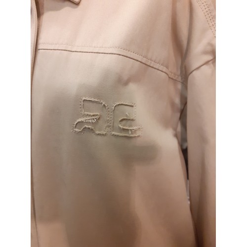 31 - Courreges of Paris-An unused beige 'Manteau' trench coat, approx 46
