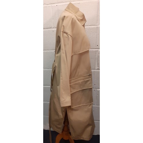 31 - Courreges of Paris-An unused beige 'Manteau' trench coat, approx 46