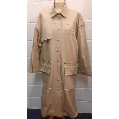 31 - Courreges of Paris-An unused beige 'Manteau' trench coat, approx 46