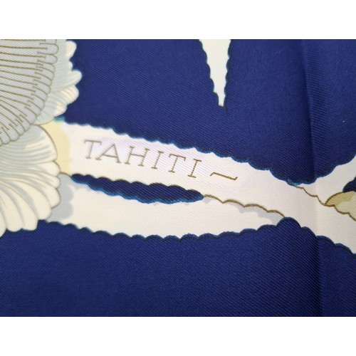 15 - Hermes- A 1990's Tahiti by Cathy Latham silk scarf having a navy ground with gold, cream and grey fl... 