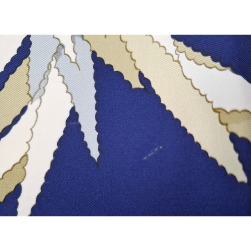 15 - Hermes- A 1990's Tahiti by Cathy Latham silk scarf having a navy ground with gold, cream and grey fl... 