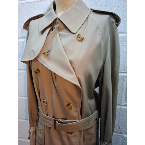 16 - Burberrys- A gents beige trench coat with matching belt,  leather buckles to belt and cuffs, 2 deep ... 
