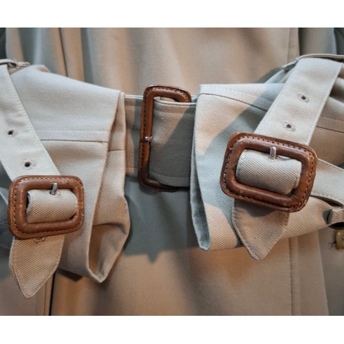 16 - Burberrys- A gents beige trench coat with matching belt,  leather buckles to belt and cuffs, 2 deep ... 