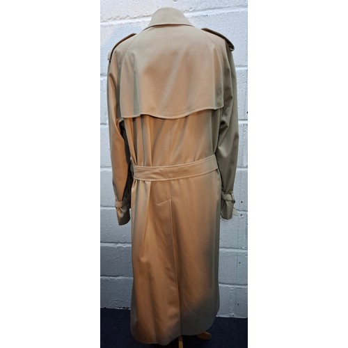 16 - Burberrys- A gents beige trench coat with matching belt,  leather buckles to belt and cuffs, 2 deep ... 