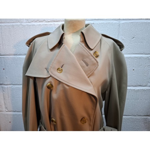 16 - Burberrys- A gents beige trench coat with matching belt,  leather buckles to belt and cuffs, 2 deep ... 