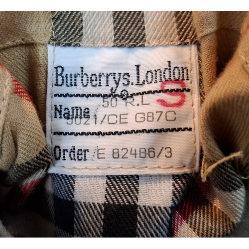 16 - Burberrys- A gents beige trench coat with matching belt,  leather buckles to belt and cuffs, 2 deep ... 